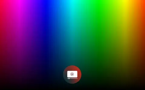 Un gradiente di colori vibranti, dal rosso al viola, blu, verde e giallo, con un'icona di riproduzione al centro. La profondità di colore è sorprendente.