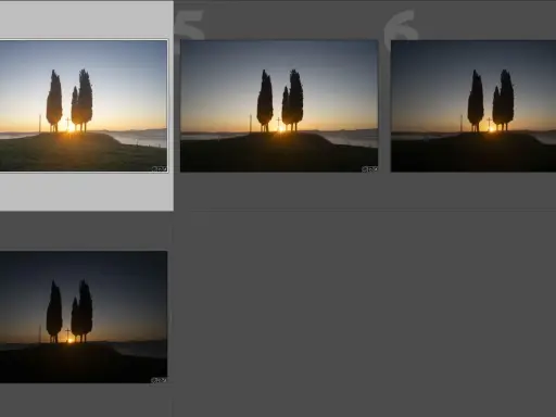 Tre cipressi solitari all'alba, con il sole che sorge tra loro. Diverse esposizioni per la bracketing fotografia, per catturare ogni dettaglio.